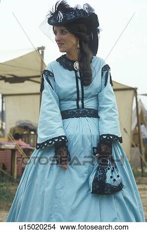 Picture - Female Participant in full dress costume during reenactment of Battle of Manassas. Fotosearch