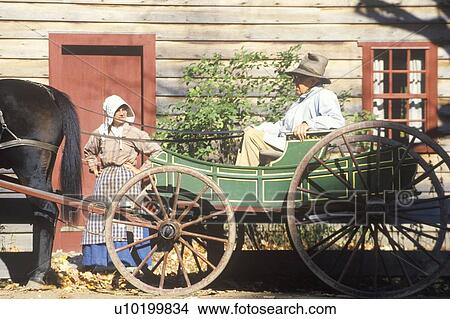 Picture - Horse drawn carriage in Historic town. Fotosearch