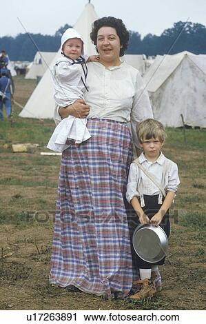 Stock Image - Mother and children participants in camp scene during recreation of Battle of Manassas. Fotosearch