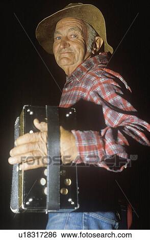Singing cowboy with accordion View Large Photo Image Stock Photograph - Singing cowboy with accordion. Fotosearch