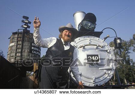 U. S. Marshall in period costume posing with Steam engine View Large Photo Image Stock Photo - U. S. Marshall in period costume posing with Steam engine. Fotosearch