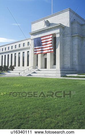 Stock Image - American Flag hung on The Federal Reserve Bank, Washington, D. C.. Fotosearch