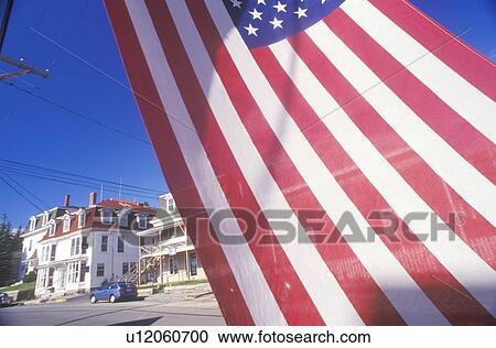 Stock Image - Homes Seen Through American Flag. Fotosearch