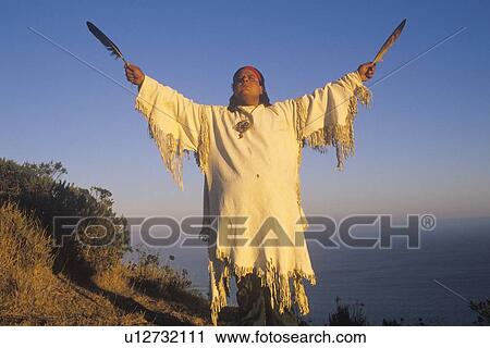Stock Image - A Native American performing an Earth ceremony. Fotosearch