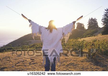Stock Image - A Native American performing an Earth ceremony. Fotosearch