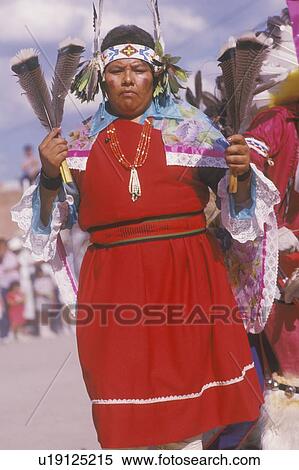 Stock Photography - A Native American woman in traditional costume at the Corn Dance ceremony. Fotosearch