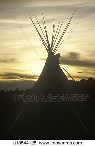Stock Photography - Teepee silhouetted at dusk. Fotosearch