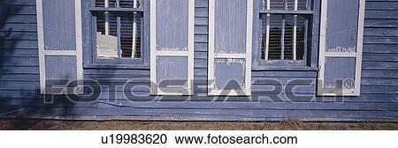 Blue shutters and exterior wall View Large Photo Image Stock Image - Blue shutters and exterior wall. Fotosearch