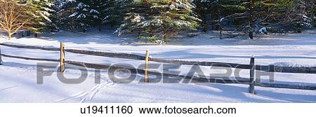 Stock Image - Fence and snow in winter. Fotosearch