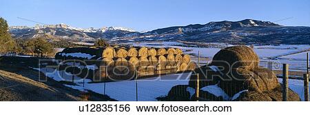 Stock Photograph - Haystacks and Cimarron Mountains. Fotosearch