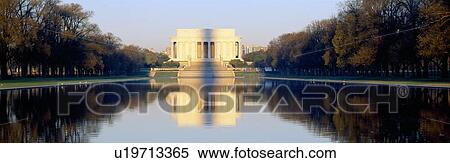 Stock Photography - Lincoln Memorial in shadow of Washington Monument at dusk. Fotosearch