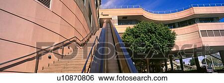 Stock Photograph - Panoramic view of escalator and stairs lead upwards in downtown LA. Fotosearch