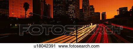 Stock Image - Downtown traffic at night. Fotosearch