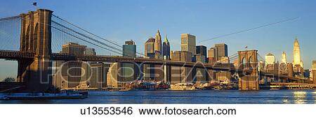 Panoramic view of Brooklyn Bridge and East River at sunrise with New York City, NY skyline View Large Photo Image Stock Photograph - Panoramic view of Brooklyn Bridge and East River at sunrise with New York City, NY skyline. Fotosearch