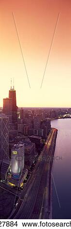 Panoramic view of Chicago skyline and John Hancock building at sunset View Large Photo Image Picture - Panoramic view of Chicago skyline and John Hancock building at sunset. Fotosearch