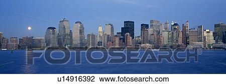 Panoramic view of full moon rising over lower Manhattan skyline View Large Photo Image Stock Image - Panoramic view of full moon rising over lower Manhattan skyline. Fotosearch