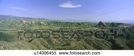 Stock Photography - Panoramic view of green rolling hills on way to Lake Hughes and Lake Castaic. Fotosearch