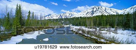 Stock Photo - Snowy mountains and Chulitna River. Fotosearch