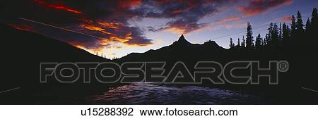Stock Image - Sunset over aspens and Bear Tooth at Pilot Mountain. Fotosearch