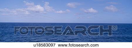 Stock Photo - Blue Pacific ocean and clouds off Hawaii. Fotosearch
