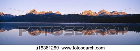 Moonset at sunrise over Redfish Lake and Sawtooth Mountains View Large Photo Image Stock Photo - Moonset at sunrise over Redfish Lake and Sawtooth Mountains. Fotosearch
