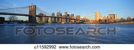 Panoramic view of Brooklyn Bridge and East River at sunrise with New York City View Large Photo Image Stock Image - Panoramic view of Brooklyn Bridge and East River at sunrise with New York City. Fotosearch