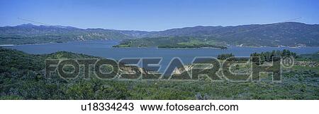 Stock Image - Panoramic view of Lake Castaic with green rolling hills and mountains. Fotosearch
