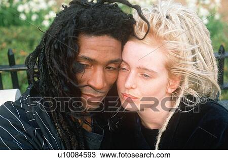 Stock Image - A black and white couple in love. Fotosearch