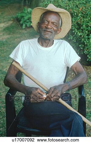 An 86-year old African-American man sitting in a chair View Large Photo Image Stock Image - An 86-year old African-American man sitting in a chair. Fotosearch