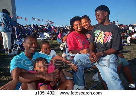 Stock Image - An African-American family picnic at the Washington National Monument. Fotosearch