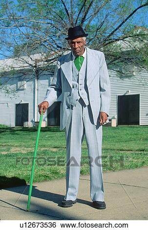 Stock Photograph - An African-American gentleman on his morning walk,. Fotosearch