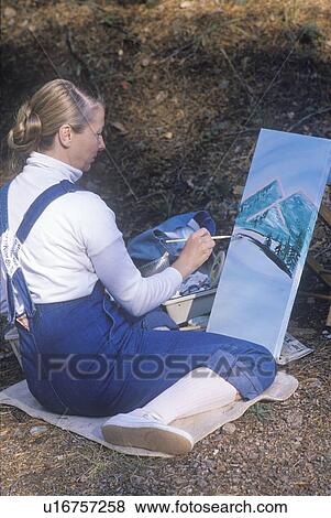 An art student painting View Large Photo Image Stock Photo - An art student painting. Fotosearch