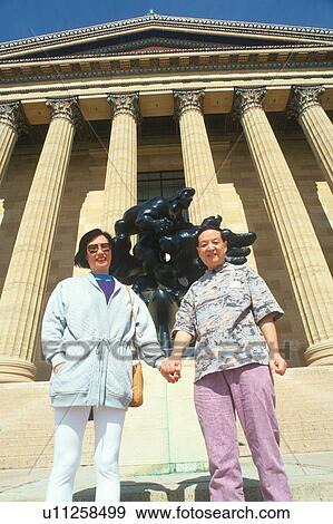 Stock Photo - An Taiwanese couple in front of the Museum of Art. Fotosearch