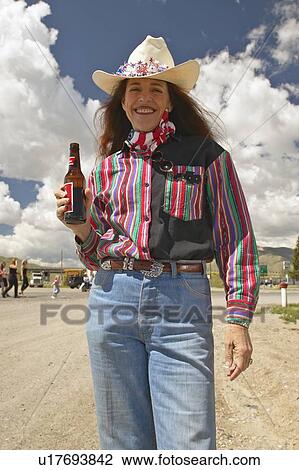 Stock Image - Cowgirl on the Fourth of July. Fotosearch