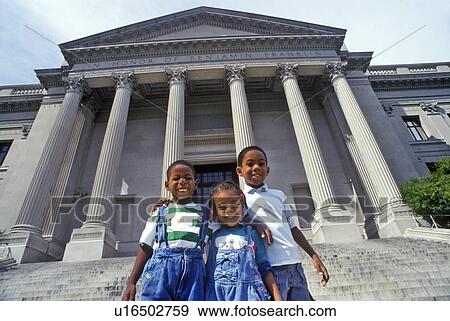 Family of tourists on the steps of the Benjamin Franklin Institute View Large Photo Image Stock Photo - Family of tourists on the steps of the Benjamin Franklin Institute. Fotosearch