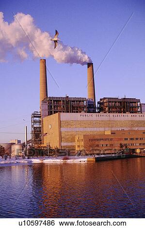 Stock Photograph - Public utility smokestacks. Fotosearch