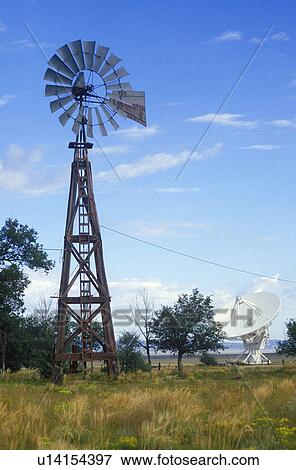Stock Photo - Radio telescope and old windmill. Fotosearch