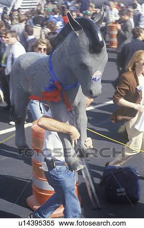 Clinton supporter carries Democratic Donkey through the crowd View Large Photo Image Stock Photography - Clinton supporter carries Democratic Donkey through the crowd. Fotosearch