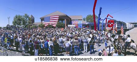 Stock Photo - Panoramic view of spectators at train station. Fotosearch