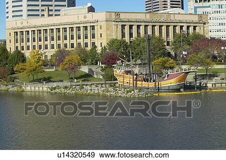 Stock Photo - Replica of Columbus' ship the Santa Maria on Scioto River, Columbus Ohio skyline in autumn. Fotosearch