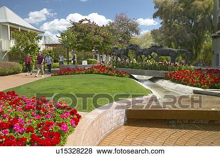 A sculpture of running horses and spring flowers in Old Town of Scottsdale View Large Photo Image Stock Photo - A sculpture of running horses and spring flowers in Old Town of Scottsdale. Fotosearch