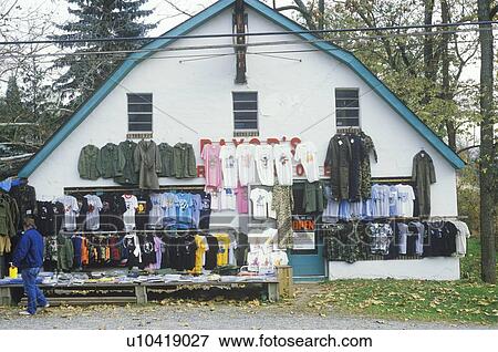 Discount clothes for sale at roadside store View Large Photo Image Stock Photo - Discount clothes for sale at roadside store. Fotosearch