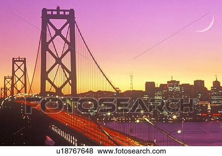 Stock Photo - Sunset on the Bay Bridge to San Francisco from Treasure Island. Fotosearch
