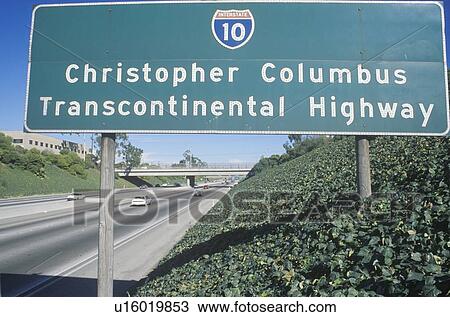 Stock Image - A sign that reads “Christopher Columbus Transcontinental Highway”. Fotosearch
