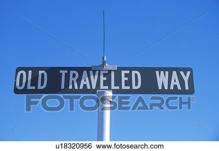 Stock Photograph - A sign that reads “Old Traveled Way”. Fotosearch