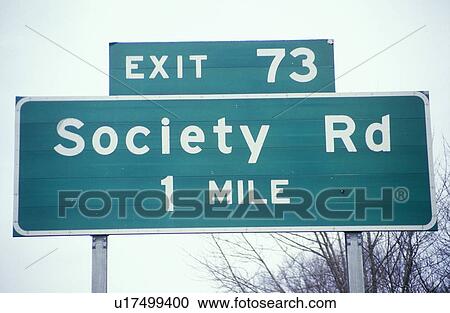 A sign that reads “Society Rd 1 mile” View Large Photo Image Stock Image - A sign that reads “Society Rd 1 mile”. Fotosearch