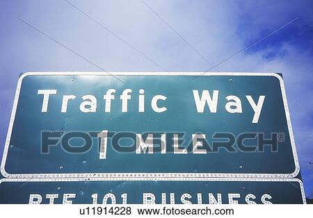 Stock Photo - A sign that reads “Traffic Way 1 Mile”. Fotosearch