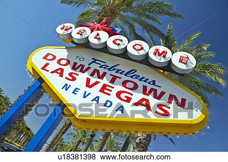 Stock Photo - Colorful sign reads “Welcome to Fabulous Las Vegas, Nevada” in daytime with blue sky. Fotosearch
