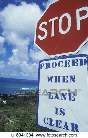 A sign that reads “Stop - proceed when lane is clear” View Large Photo Image Picture - A sign that reads “Stop - proceed when lane is clear”. Fotosearch