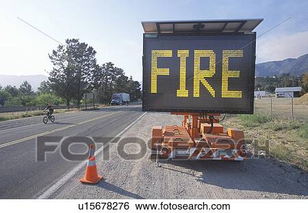 Stock Photograph - Flashing highway sign: Fire. Fotosearch